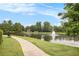 Enjoy the walking path alongside the pond with fountain feature at 4445 Vanadium Bend, Cumming, GA 30040