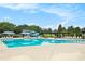 Resort-style pool with lounge chairs, umbrellas and a slide for endless summer fun at 4445 Vanadium Bend, Cumming, GA 30040