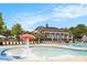 Large pool area includes a shallow splash pool and plenty of lounge chairs for relaxing at 4445 Vanadium Bend, Cumming, GA 30040