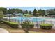 Community pool area is fenced and well-landscaped with mature trees and plenty of seating at 4445 Vanadium Bend, Cumming, GA 30040