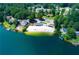Beautiful lakefront community featuring private beach, boat docks, and clubhouse at 9058 Woodlake Lane, Villa Rica, GA 30180