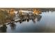 Panoramic aerial view of lakeside homes with lush greenery and lake access at 9058 Woodlake Lane, Villa Rica, GA 30180