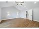 Bedroom with wood floor, vaulted ceiling, and walk-in closet at 9058 Woodlake Lane, Villa Rica, GA 30180