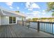 Exterior wooden deck overlooking water with a railing and scenic views at 9058 Woodlake Lane, Villa Rica, GA 30180