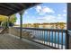 Wooden deck with a scenic view of the lake and surrounding neighborhood at 9058 Woodlake Lane, Villa Rica, GA 30180