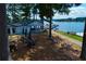 Charming lakeside marina with outdoor seating, boat docks, and serene water views at 9058 Woodlake Lane, Villa Rica, GA 30180