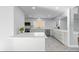 Bright kitchen featuring white cabinetry, quartz countertops, stainless steel appliances, and a kitchen island at 9058 Woodlake Lane, Villa Rica, GA 30180