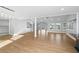 Open-concept living room with hardwood floors, recessed lighting, and plenty of natural light at 9058 Woodlake Lane, Villa Rica, GA 30180