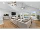 Spacious living room with high ceilings, large windows, and a comfortable seating area perfect for relaxation and entertainment at 9058 Woodlake Lane, Villa Rica, GA 30180