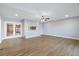 Spacious living room features a modern fireplace and double doors to outdoor space at 9058 Woodlake Lane, Villa Rica, GA 30180
