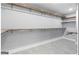 Spacious walk-in closet with built-in wooden shelves and hanging rods at 9058 Woodlake Lane, Villa Rica, GA 30180
