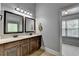 Bathroom featuring double vanity, framed mirrors and neutral color scheme at 2020 Walking Horse Trl, Cumming, GA 30041