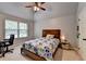 Bedroom with a bed, ceiling fan, and windows at 2020 Walking Horse Trl, Cumming, GA 30041