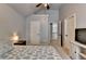 Bright bedroom with a ceiling fan, overhead light, and views to hallway at 2020 Walking Horse Trl, Cumming, GA 30041