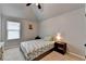 Bright bedroom with a ceiling fan, overhead light, and small side tables at 2020 Walking Horse Trl, Cumming, GA 30041