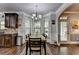 Cozy dining area with ample light, neutral colors, adjacent to a well-appointed kitchen at 2020 Walking Horse Trl, Cumming, GA 30041
