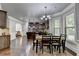 Spacious dining room open to a modern kitchen with stainless appliances and a large kitchen island at 2020 Walking Horse Trl, Cumming, GA 30041