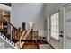 Welcoming foyer with hardwood floors, staircase, and decorative console table at 2020 Walking Horse Trl, Cumming, GA 30041