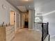 Upstairs hallway with doors to bedrooms and laundry room, offering convenience and style at 2020 Walking Horse Trl, Cumming, GA 30041