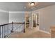 Bright upstairs hallway leading to bedrooms and bathrooms, perfect for Gathering living at 2020 Walking Horse Trl, Cumming, GA 30041