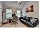 Home office with a desk, comfortable seating, and natural light at 2020 Walking Horse Trl, Cumming, GA 30041