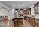 Modern kitchen boasting dark cabinets, stainless appliances, and a breakfast bar at 2020 Walking Horse Trl, Cumming, GA 30041
