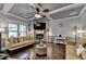 Inviting living room showcasing a stone fireplace, hardwood floors, and coffered ceilings at 2020 Walking Horse Trl, Cumming, GA 30041