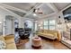 Bright living room with stone fireplace, and hardwood floors, creating an inviting and comfortable space at 2020 Walking Horse Trl, Cumming, GA 30041