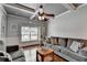 Inviting living room with hardwood floors, coffered ceiling, and window with natural light at 2020 Walking Horse Trl, Cumming, GA 30041