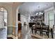 Open concept living space featuring dark wood floors, modern appliances and an inviting dining area at 2020 Walking Horse Trl, Cumming, GA 30041
