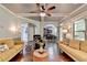 Comfortable living area featuring hardwood floors, coffered ceilings, and seamless transition to other rooms at 2020 Walking Horse Trl, Cumming, GA 30041