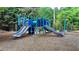 A colorful playground with slides, climbing structures, and a soft landing surface for safety at 2020 Walking Horse Trl, Cumming, GA 30041