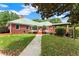 Secluded backyard featuring a wooden deck, gazebo, and lush green lawn at 2620 Dr Bramblett Rd, Cumming, GA 30028