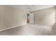 Neutral bedroom featuring a ceiling fan, carpeted floors, and access to other areas of the home at 2620 Dr Bramblett Rd, Cumming, GA 30028