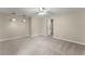 Spacious carpeted bedroom featuring recessed lighting, ceiling fan and access to other areas of the home at 2620 Dr Bramblett Rd, Cumming, GA 30028