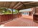 Expansive wooden deck with covered area, perfect for outdoor entertaining and relaxation at 2620 Dr Bramblett Rd, Cumming, GA 30028