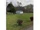 Detached garage in a spacious yard; perfect for storage or a workshop at 2620 Dr Bramblett Rd, Cumming, GA 30028