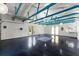 Spacious garage interior with high ceilings and bright blue accents offers a versatile and adaptable space at 2620 Dr Bramblett Rd, Cumming, GA 30028
