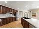 Modern kitchen featuring stainless steel appliances, hardwood floors, granite counters, and a kitchen island at 2620 Dr Bramblett Rd, Cumming, GA 30028
