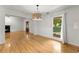Open living area with hardwood floors, abundant natural light and front door at 2620 Dr Bramblett Rd, Cumming, GA 30028