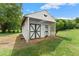 Quaint backyard outbuilding with lattice accents, offering additional storage or workspace at 2620 Dr Bramblett Rd, Cumming, GA 30028