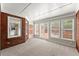 Bright sunroom with large windows and access to the outside at 2620 Dr Bramblett Rd, Cumming, GA 30028