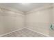 Spacious walk-in closet with ample wire shelving and tiled floors at 2620 Dr Bramblett Rd, Cumming, GA 30028
