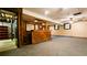 Finished basement with wooden bar, textured walls, and carpeted floor, perfect for entertaining guests at 1110 Blackwell Rd, Marietta, GA 30066