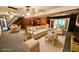Basement entertaining area with a bar, sitting area, and stairs to the upper level at 1110 Blackwell Rd, Marietta, GA 30066