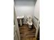 Simple bathroom with a pedestal sink, wood-look floors, and a toilet at 1110 Blackwell Rd, Marietta, GA 30066