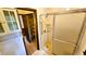 Bathroom featuring a shower with glass doors, tile floors, and built in storage at 1110 Blackwell Rd, Marietta, GA 30066