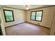 Standard bedroom featuring neutral carpeting, a window, base trim, and a ceiling fan at 1110 Blackwell Rd, Marietta, GA 30066