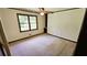 Clean bedroom featuring neutral carpeting, a window, base trim, ceiling fan, and closet at 1110 Blackwell Rd, Marietta, GA 30066