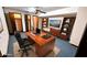 Home office with large wooden desk and built-in bookshelves, ideal for remote work and study at 1110 Blackwell Rd, Marietta, GA 30066